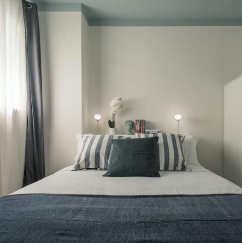 Get some rest in the comfy bedroom after a busy day in Milan