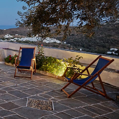 Enjoy an ice-cold ouzo at sunset on the private terrace