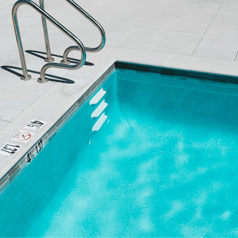 Swim and play in the building's communal pool