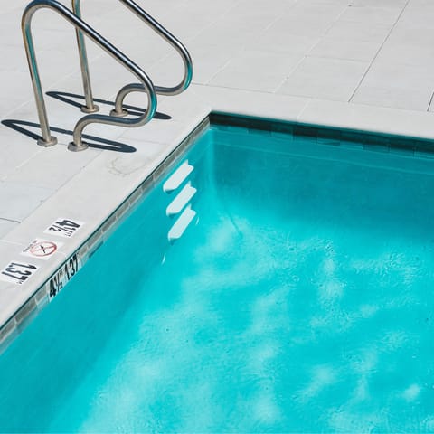 Swim and play in the building's communal pool