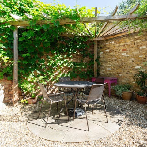 Dine alfresco in the leafy garden following a riverside stroll