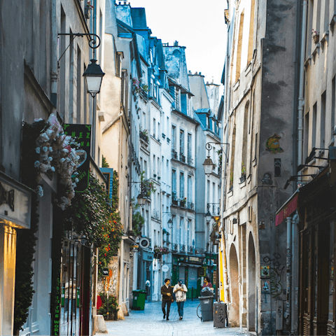 Wander the vibrant streets of Le Marais, 14-minute walk away