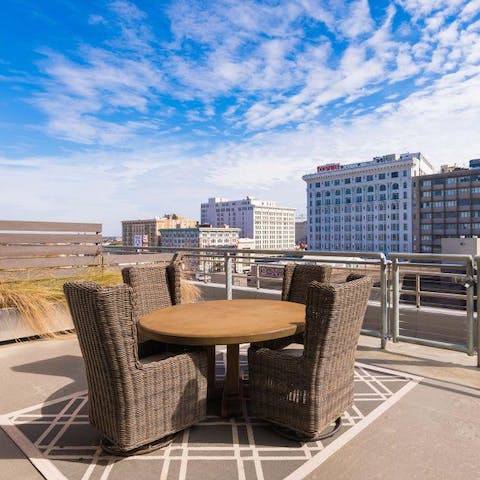 Take your morning coffee up to the communal roof terrace and watch the world pass by