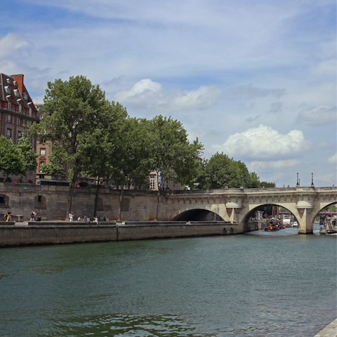Stroll along the banks of the Seine as the sun warms your skin