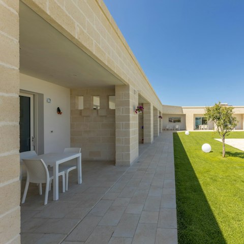 Dine on the private patio with shared garden views