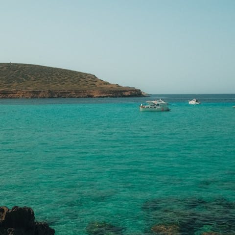 Book a boat trip from nearby Cala Vedella