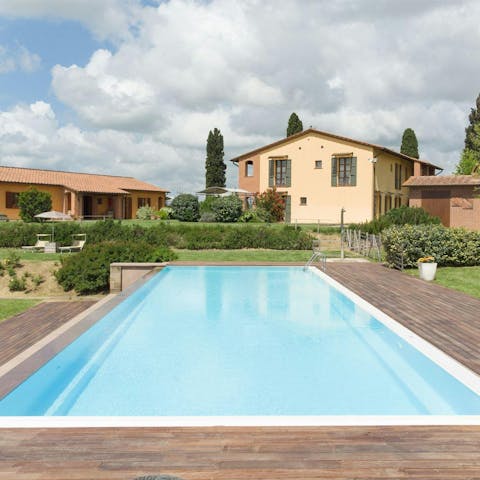 Relax in the Tuscan sun next to the shared pool