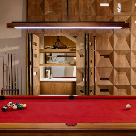 Unwind over a friendly game of pool once night falls