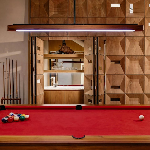 Unwind over a friendly game of pool once night falls