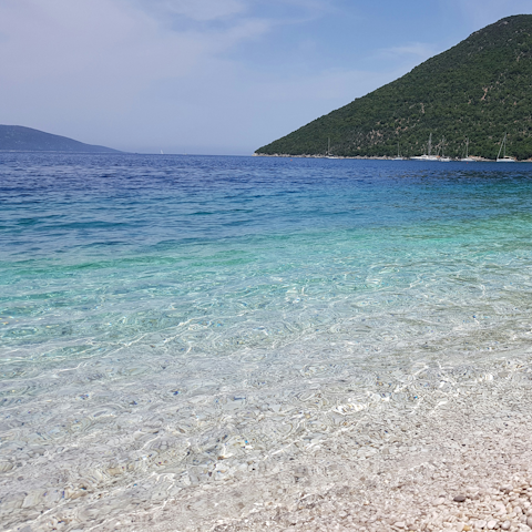 Drive to Foneas Beach and float in the turquoise water