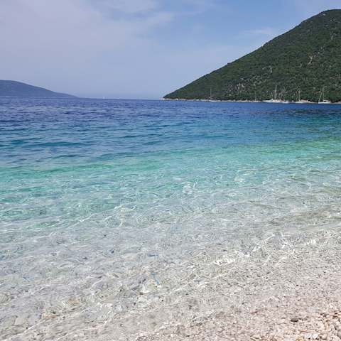 Drive to Foneas Beach and float in the turquoise water