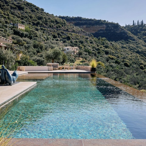 Swim unhurried laps in the private infinity pool overlooking the Messinian Gulf