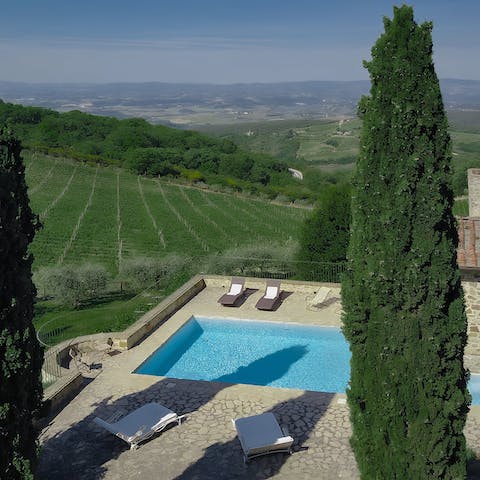 Laze away the day beside the private pool with a view