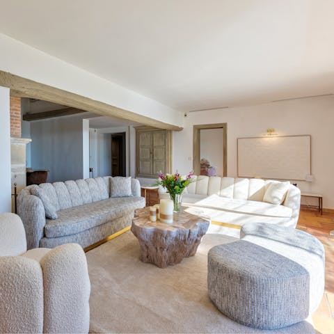 Throw open the French doors and relax in the stylish living room