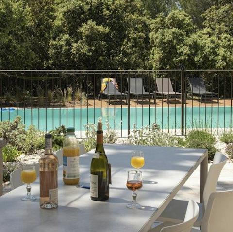 Dine by the private pool on long summer evenings