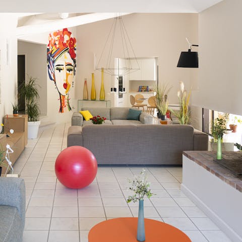 We love the bright main living space, filled with light and a Kahlo-inspired mural