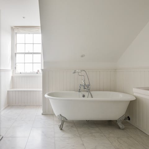 Take a well-earned soak in the free-standing bathtub