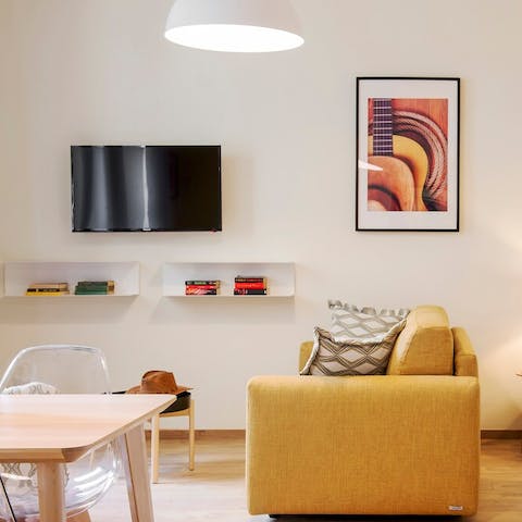 Sit back and relax on the yellow sofa after a busy day