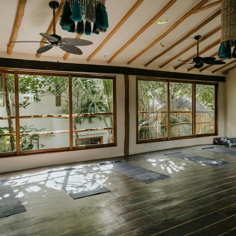 Enjoy a restorative yoga session in the on-site studio