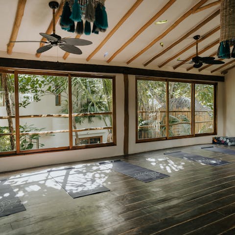 Enjoy a restorative yoga session in the on-site studio