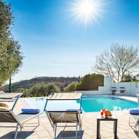 Soak up the sunshine by the tranquil pool