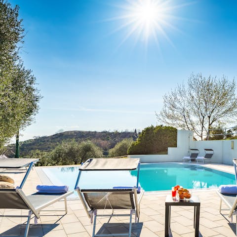 Soak up the sunshine by the tranquil pool