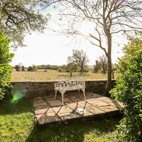 Take in the beautiful views over the Windrush Valley from the private garden