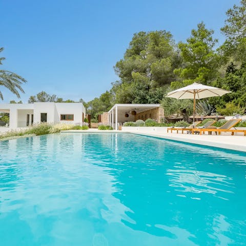 Relax by the pool with a drink in hand