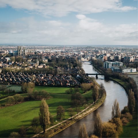 Stroll along the River Ouse or walk into York's historic city centre in fifteen minutes