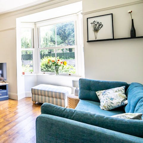 Curl up with a well-thumbed book in the light-filled living room