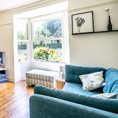 Curl up with a well-thumbed book in the light-filled living room