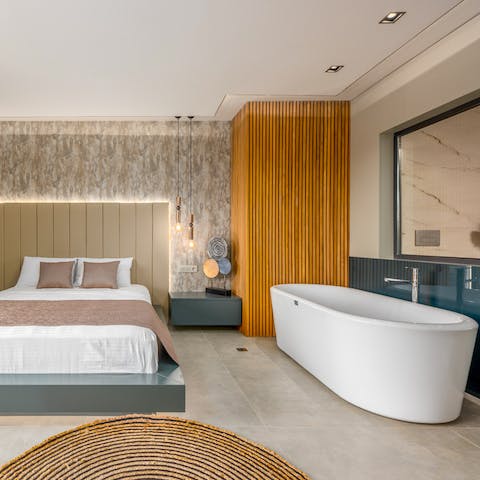Sink into the hot waters of a luxurious bath, with tubs in the double rooms