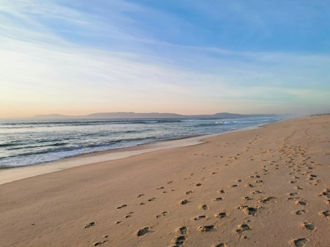 Explore Comporta Beach's wild, dune-backed Atlantic shoreline, a nineteen-minute walk