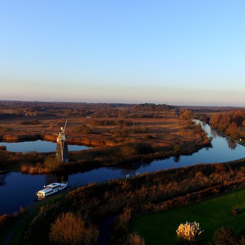 Putter down the Norfolk Broads on a chartered boat, a ten-minute drive away