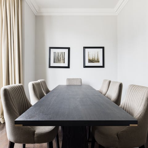 Sit down to a family meal at the large dark-wood table