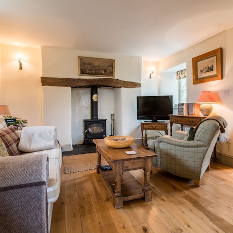 Spend cosy evenings relaxing by the wood burning fire
