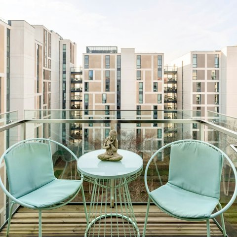 Relax on your private balcony overlooking the shared courtyard