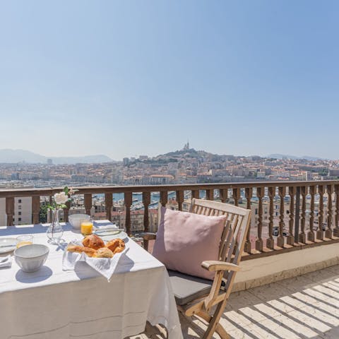 Enjoy breakfast with panoramic views across the coastal city
