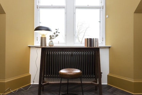 Work from home at the compact desk in the window