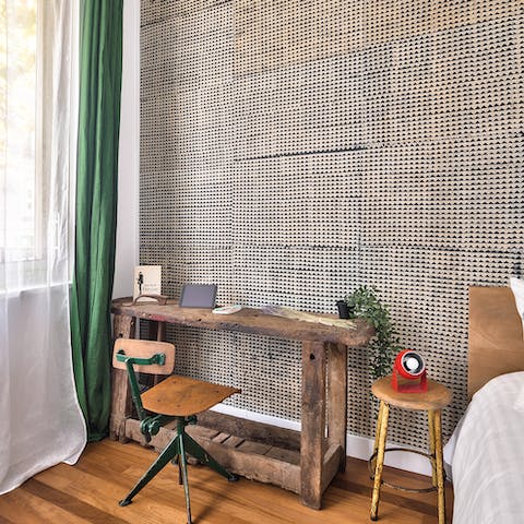 Catch up on work at the hand-crafted wooden desk