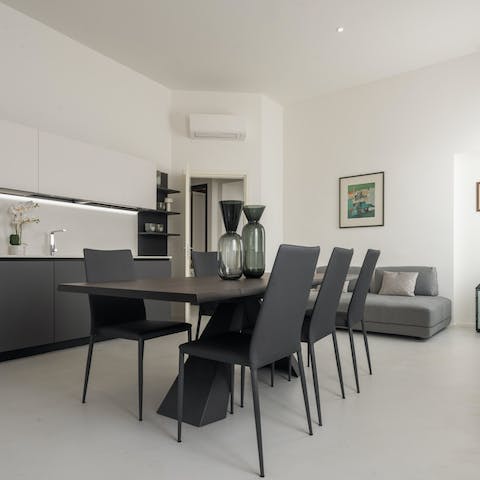 Gather around the chic dining table for a relaxed evening of good food, wine, and card games