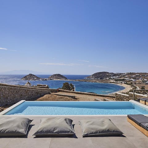 Take a dip in the pool with views of Kalafatis beach