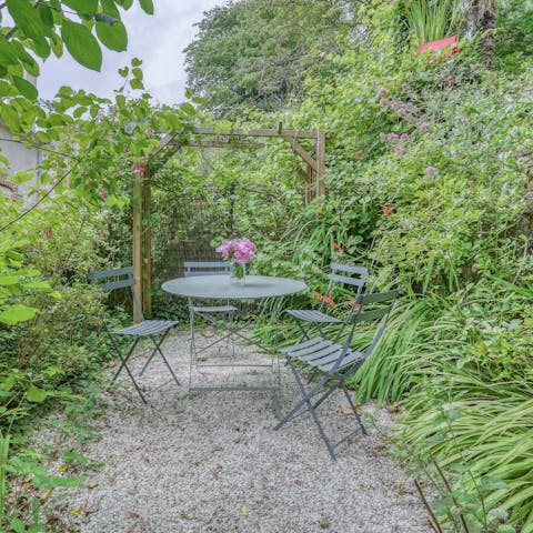 Sit down at the bistro table to enjoy wine and cheese surrounded by nature