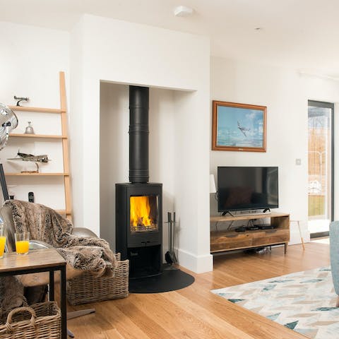 Light the fire and savour cosy gatherings in the living room