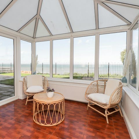 Admire the sea views while perched in the conservatory