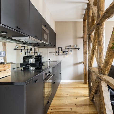 Start mornings off by making coffee in the sleek, industrial-style kitchen