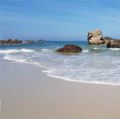 Enjoy a stroll along the sands of De Longchamp beach, a few steps away