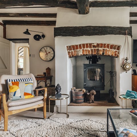 Cosy up around the inglenook fireplace