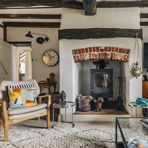 Cosy up around the inglenook fireplace
