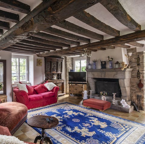 Gather in the cosy living room under traditional wooden beams and get the fireplace roaring